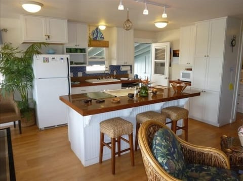 Kitchen with island and lots of cabinetry for kitchen electrics