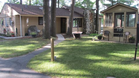 Main house on the lake with paved driveway