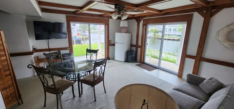 1st Flr Family Rm. w/ Refrigerator, Sleeper Sofa, Sliding Doors w/ water views.