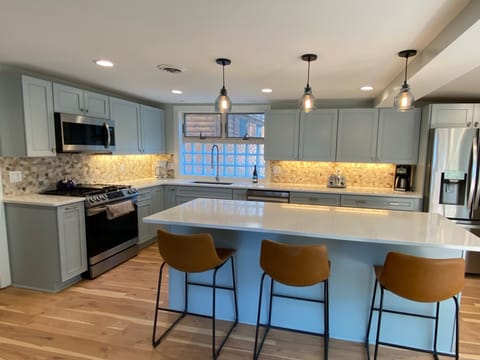 8ft island with comfortable barstool seating. Electrical outlets on both ends...