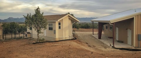 Laundry room on the right. Shaded dog kennel on the left. 