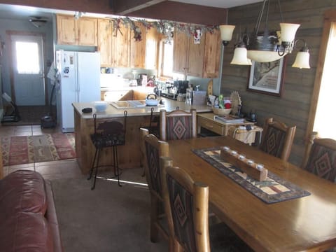 2014 View of Dining Room, Kitchen and Entrance Door as seen from Deck Access.