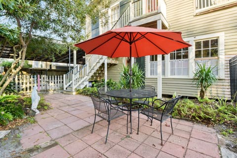 Outdoor seating in the courtyard at the rear of the house near the pool. 