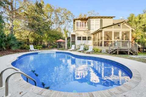 View of the pool and rear of the Creole Cottage