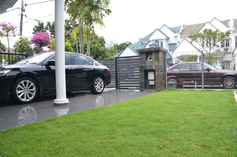 The greens, next to car porch