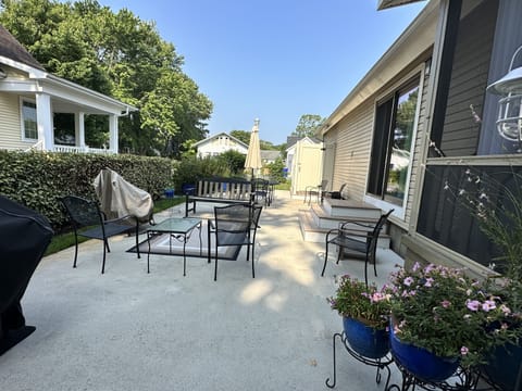 Large patio with propane grill and outdoor dining table 
