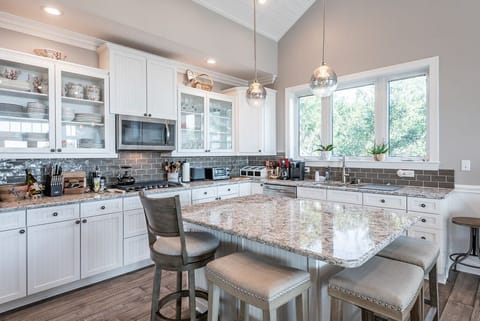 One of the highlights of the house is a large kitchen with an oversized kitchen island.