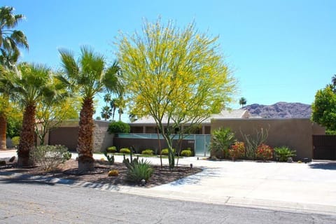 Circle driveway and gated courtyard at front of home.