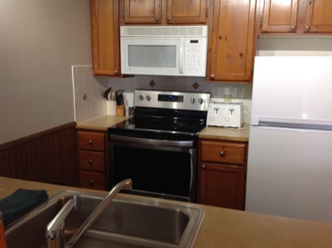 Kitchen with new ceramic cook top stove