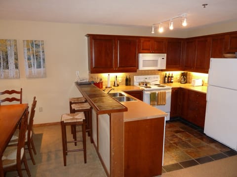This kitchen feels like a home. Cook in and save money and enjoy being here!