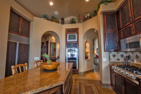 Large granite island for eating and entertaining with views of ocean&pool/spa