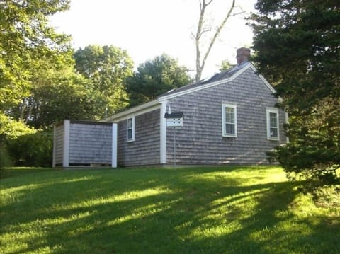 Back of separate guest quarters and outdoor shower