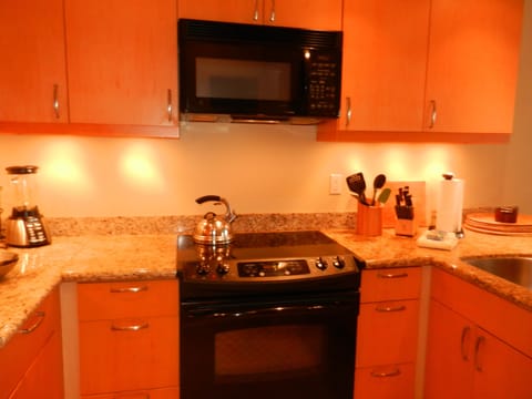 Kitchen expanded U, granite, Micro, drop-in oven/cooktop.  Henkle knives, teapot