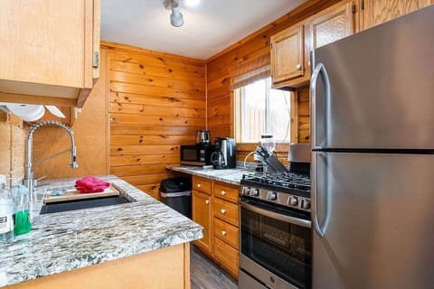 Granite countertops, large farm sink and stainless steel appiances