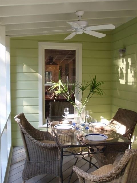 Screened Porch Dining Table, enjoy a meal overlooking the pool
