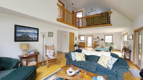 Living room opens to dining area and kitchen beyond