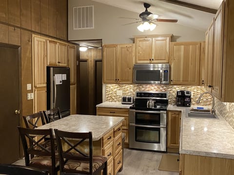 Fully stocked kitchen with double oven range, microwave, dishwasher & fridge