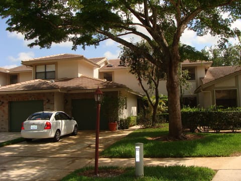 House front view single car garage and driveway for additional 2 cars