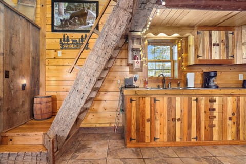 Loft area is accessible with a ladder like staircase. Use two hands at all times