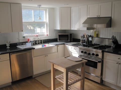Main kitchen featuring professional grade stainless steel appliances