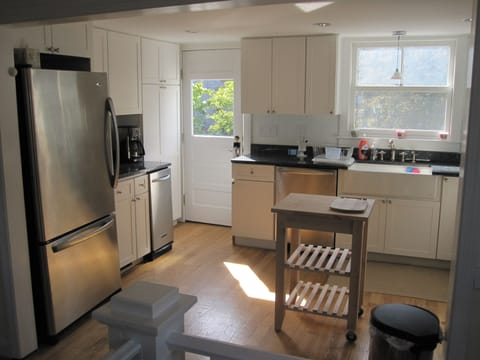 Main kitchen featuring professional grade stainless steel appliances