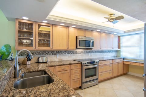 Stainless appliances, granite counter tops, and tile floors are gorgeous. 
