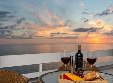 Enjoy romantic sunsets while you wind down with a glass of wine on the balcony. 