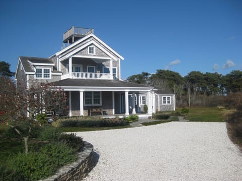 Seashell drive past stonework and gardens to front of house