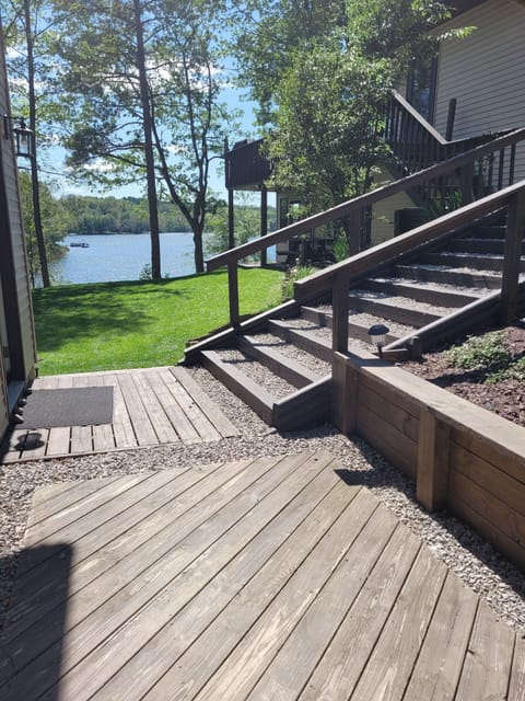 Boardwalk and stairs from driveway and garage to home