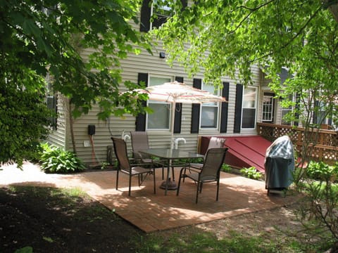 Shady backyard with gas grill