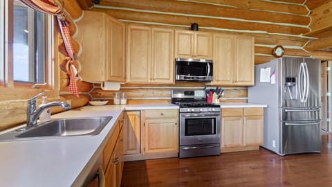 Full-size fridge pictured. Flour, oil, and many seasonings regularly stocked.