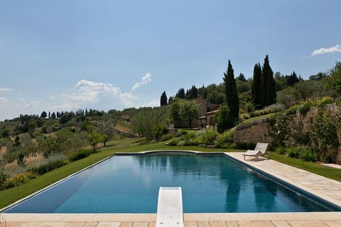 Private pool, grounds and house.