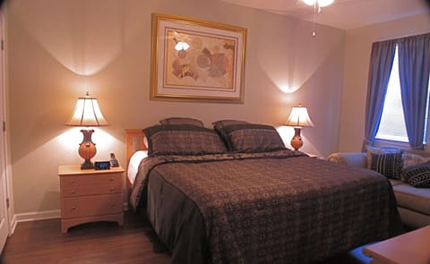 Master bedroom with King size bed and ceiling fan