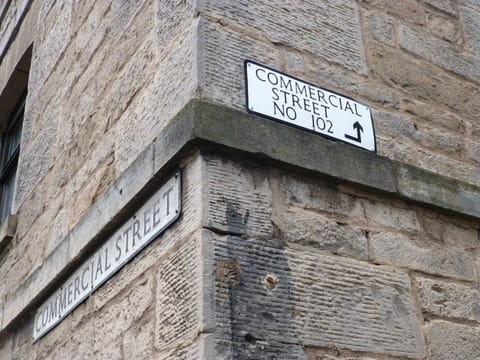 The entrance to 102 Commercial Street is at the back of the building