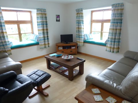 The living-room is dual aspect with window seats