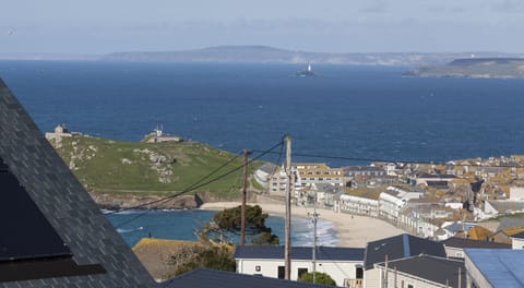 View from house of Porthmeor Beach, Island, and Godrevy Lighthouse, and Bay.