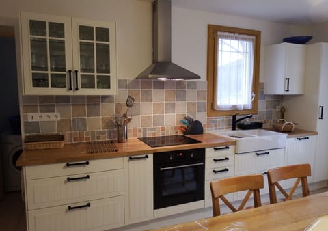 Large kitchen with a table for 8, on the left a small with the washing machine