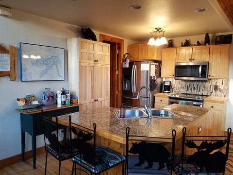 Open plan kitchen & bar area and full walk-in pantry room