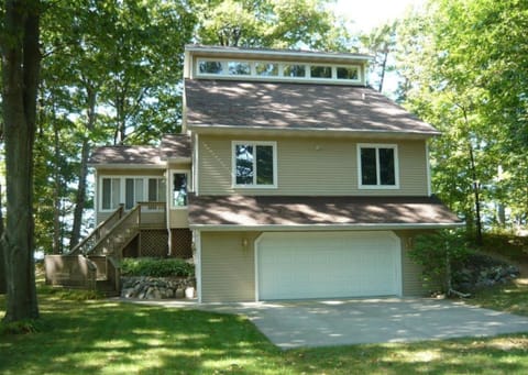 front of home with 2 car garage + additional parking
