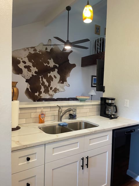 Opened up the space between the kitchen and living room. Added a big ceiling fan
