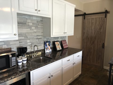 Lower level Wet bar wine fridge, microwave, 5 pot coffee maker 