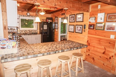 Open kitchen/bar to living, dining and family theater room. Completely stocked.