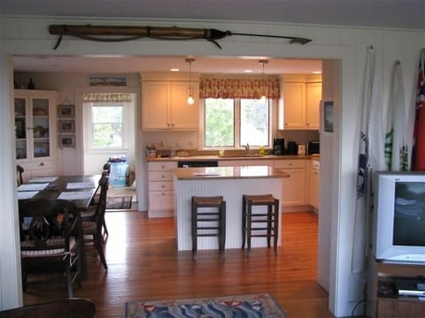 Equipped and modern kitchen and inside dining area.