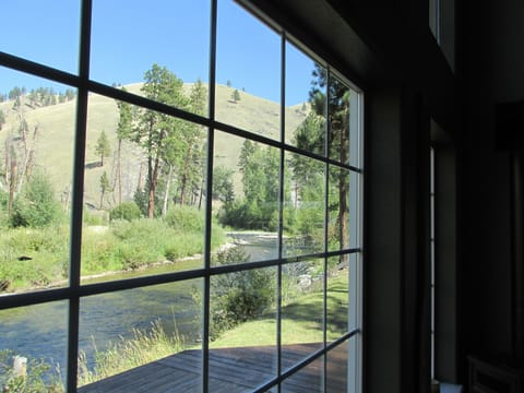 Living room windows looking upstream