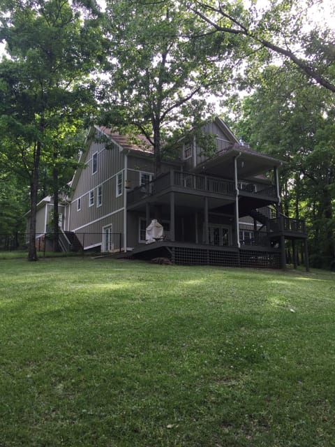 Back yard. Back porches and fenced dog area with access to dog room. 