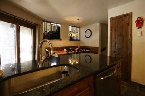 Kitchen level has openings that look into the livingroom area.