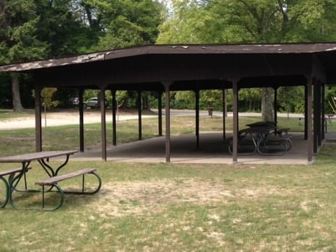 Shaded picnic area with restroom facilities at the Crystal Lake public beach 