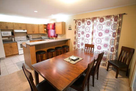 Open kitchen, dining rm table seats 8, 4 at counter. Walkout to 3 season porch.