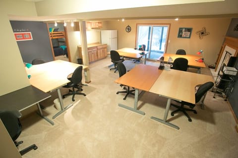 Craft room with kitchenette, full size refridgerator, walkout patio.