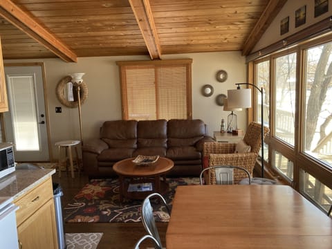 A cozy and bright living room has plenty of seating